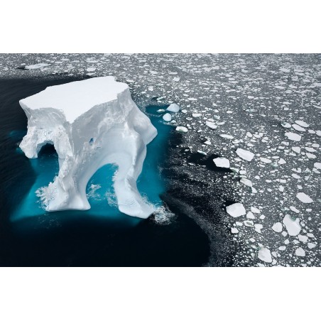 Daniel Beltra - An iceberg floats in sea ice of the Ross Sea - 2007